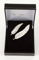small and large feather brooch