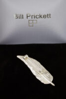 small feather brooch